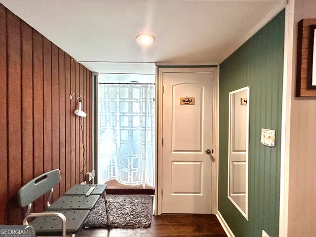 a bathroom with a tub and a window