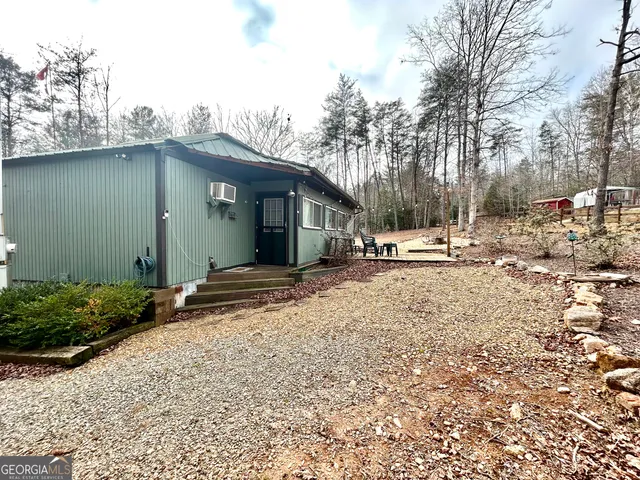 a view of house with snow on the road