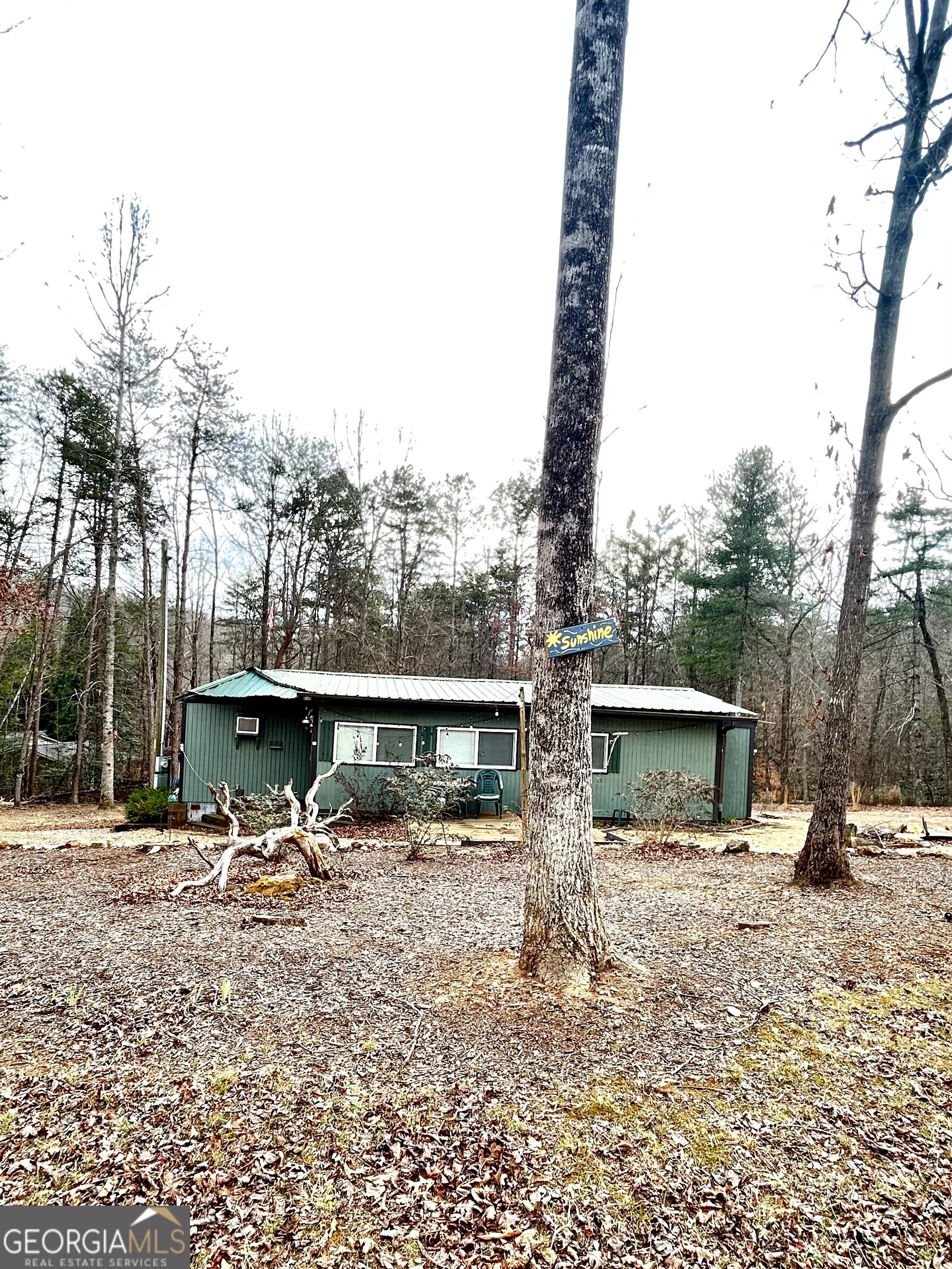 6 Grove Lane Cleveland, GA 30528 - Photo 5 of 40 a front view of a building with trees