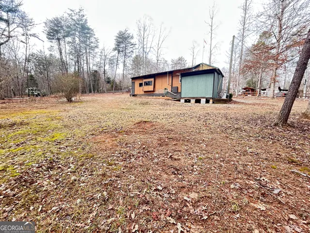 a view of house with outdoor space