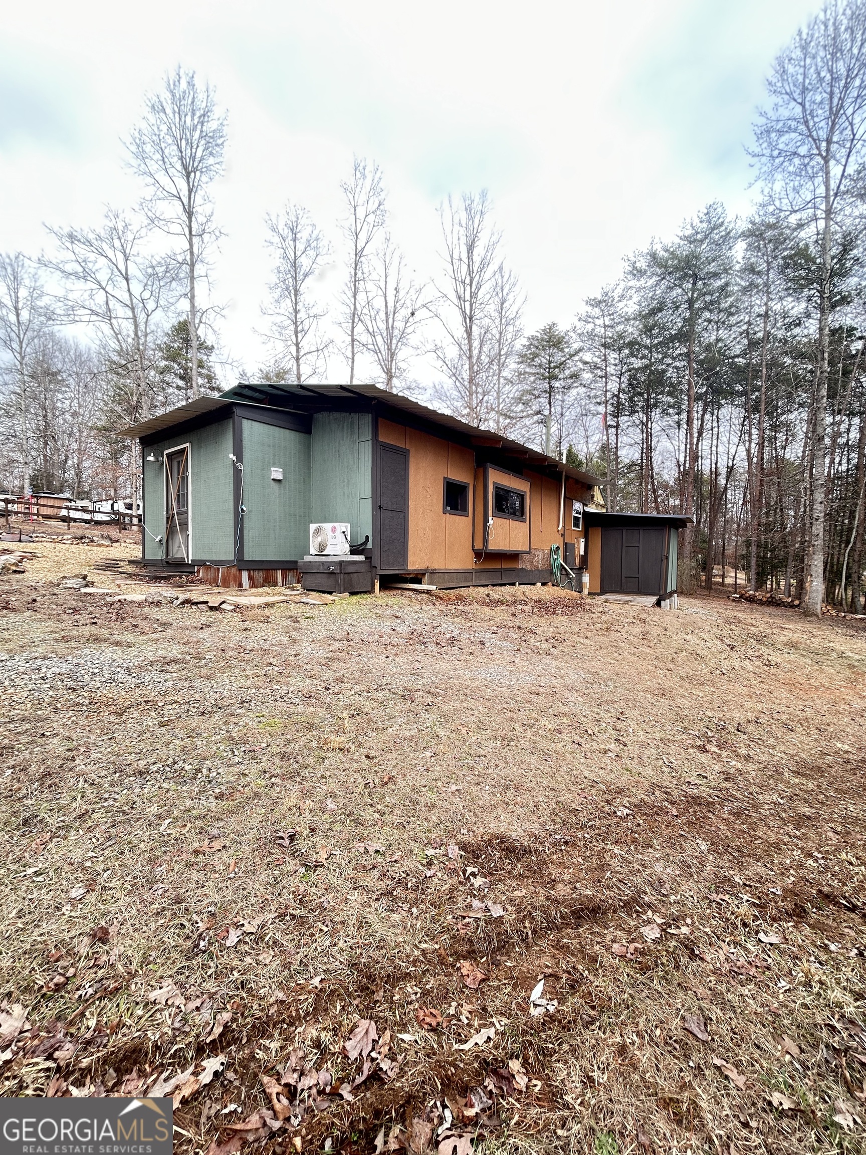 6 Grove Lane Cleveland, GA 30528 - Photo 9 of 40 a white house that has a tree in front of it