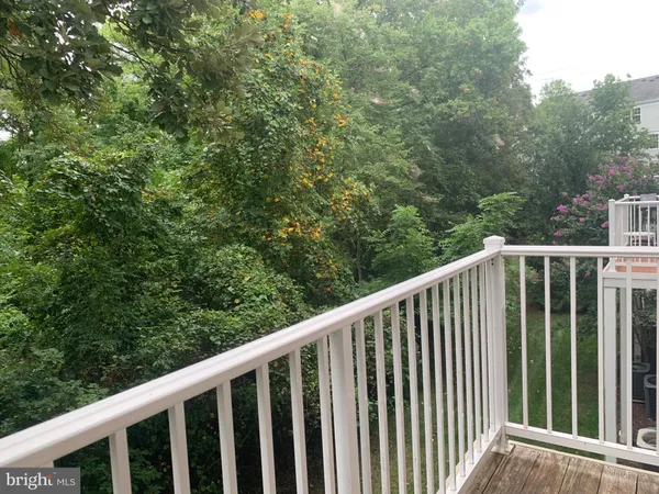 a balcony with trees in front of it