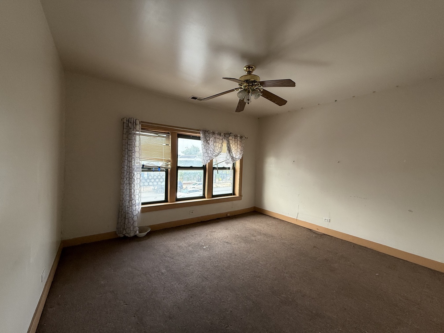 5818 West North Avenue Chicago, IL 60639 - Photo 17 of 37 a view of an empty room with a window