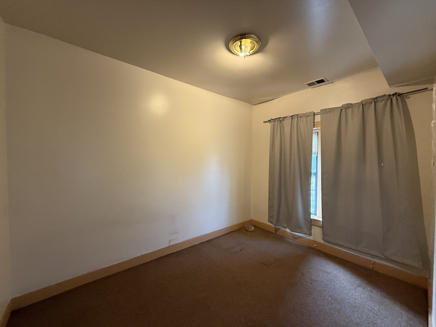 5818 West North Avenue Chicago, IL 60639 - Photo 18 of 37 an empty room with window