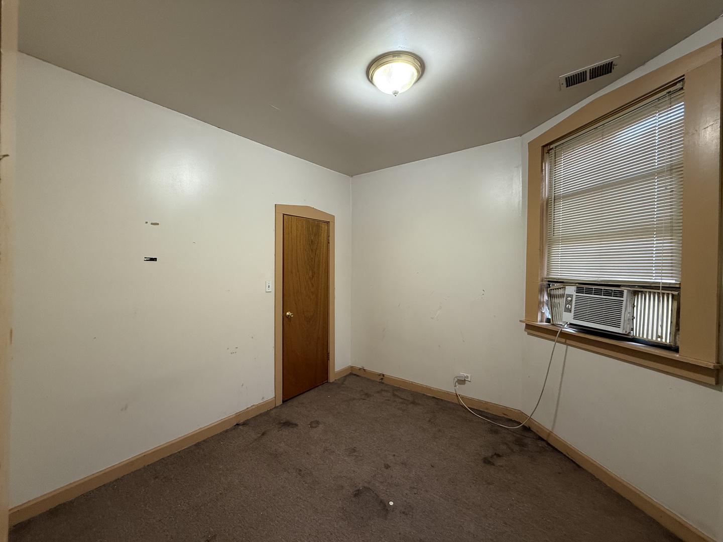 5818 West North Avenue Chicago, IL 60639 - Photo 20 of 37 an empty room with a window