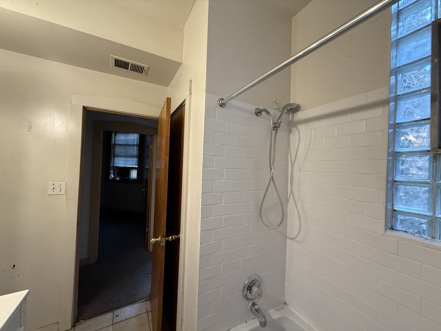 5818 West North Avenue Chicago, IL 60639 - Photo 23 of 37 a bathroom with a glass shower door