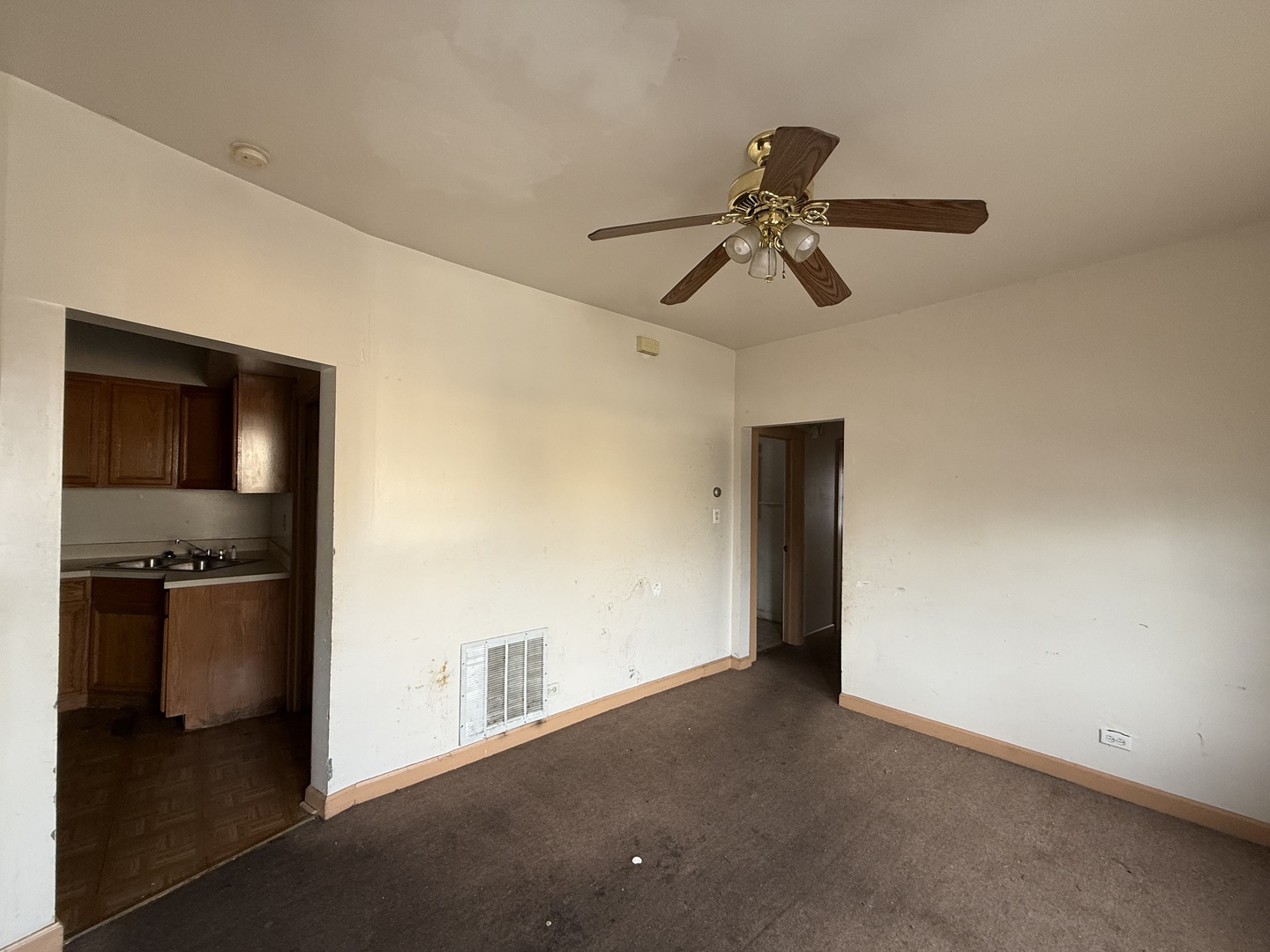 5818 West North Avenue Chicago, IL 60639 - Photo 25 of 37 a view of a livingroom with a ceiling fan and entryway