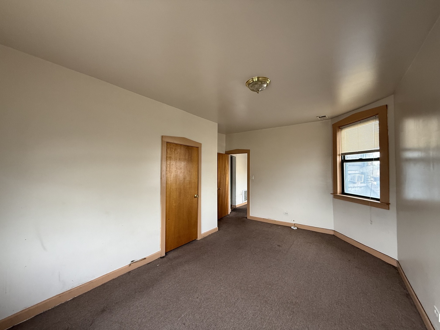 5818 West North Avenue Chicago, IL 60639 - Photo 27 of 37 an empty room with windows and closet