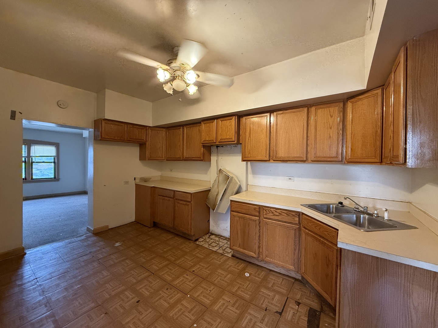 5818 West North Avenue Chicago, IL 60639 - Photo 28 of 37 a kitchen with a stove a sink and cabinets