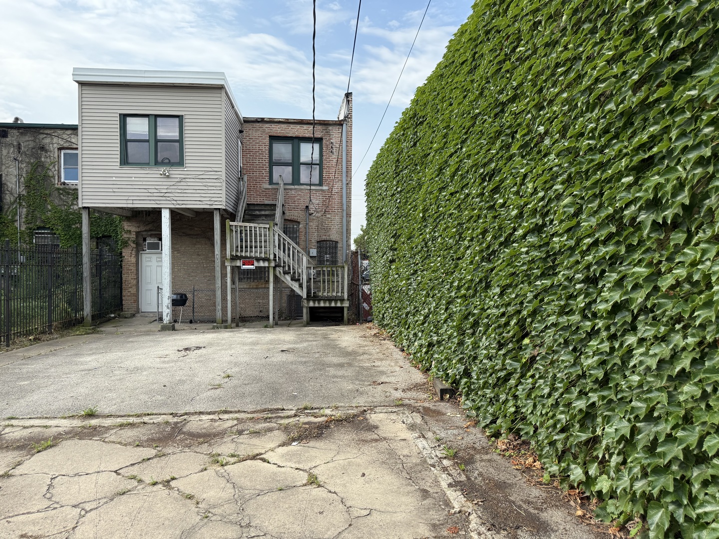 5818 West North Avenue Chicago, IL 60639 - Photo 32 of 37 a front view of a house with a yard