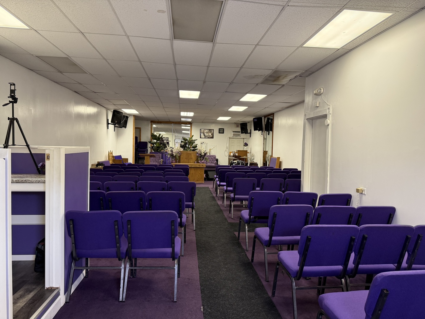 5818 West North Avenue Chicago, IL 60639 - Photo 4 of 37 a media room with lots of chairs and a projector screen