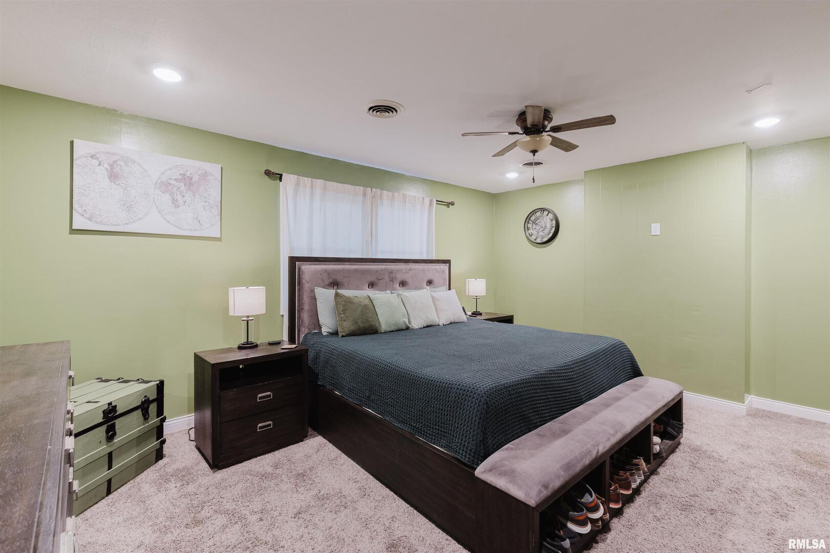 1821 South 27th Street Herrin, IL 62948 - Photo 14 of 35 a bedroom with a bed and a ceiling fan