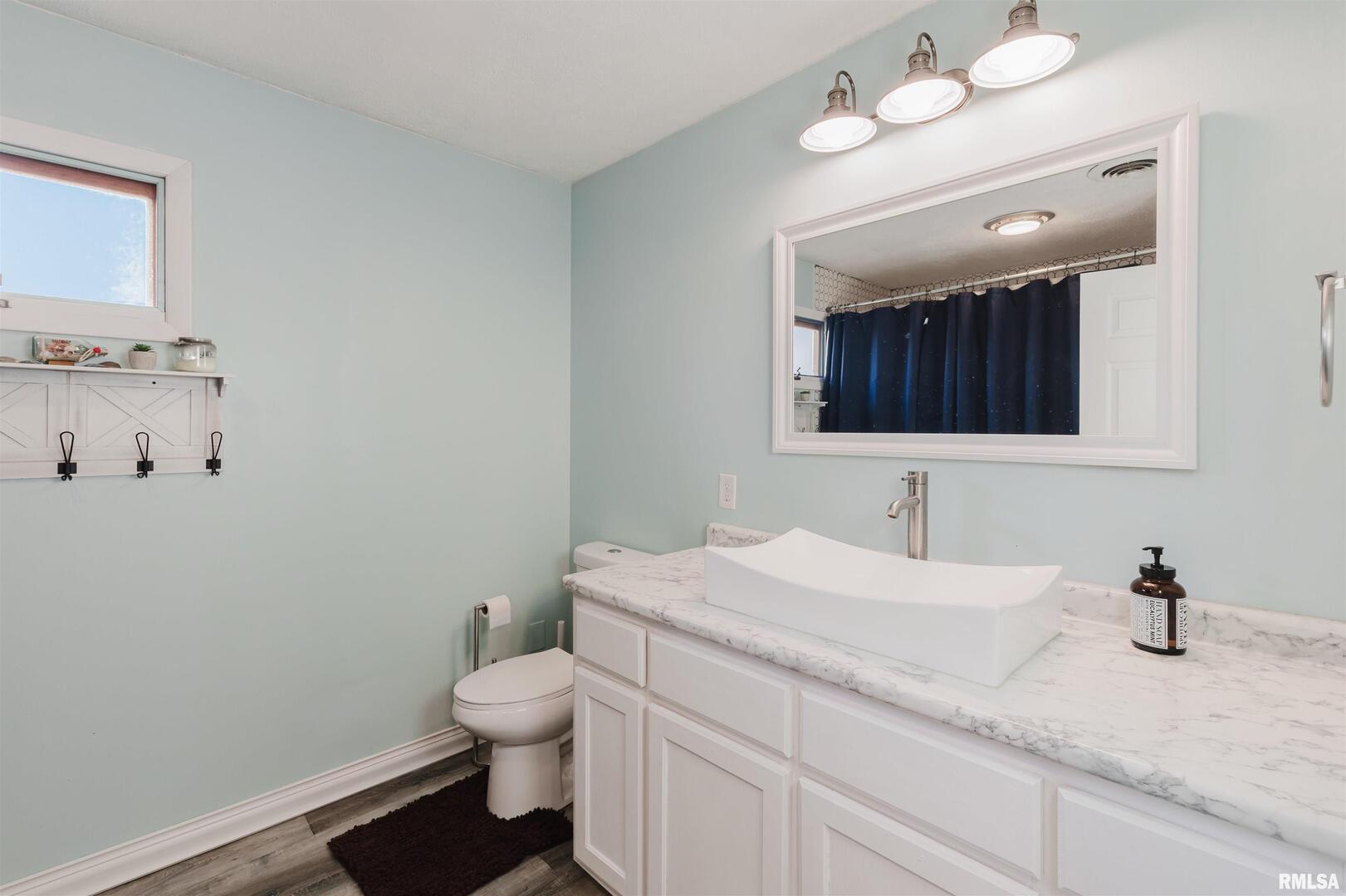 1821 South 27th Street Herrin, IL 62948 - Photo 15 of 35 a bathroom with a granite countertop sink mirror and toilet