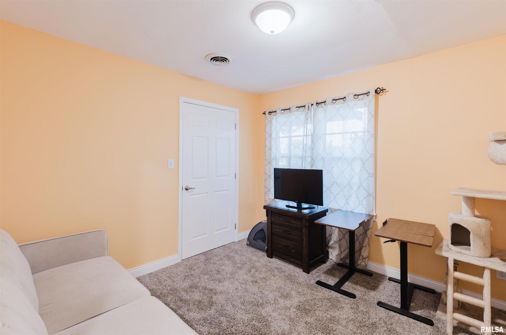 1821 South 27th Street Herrin, IL 62948 - Photo 17 of 35 a view of a workspace with furniture and a window