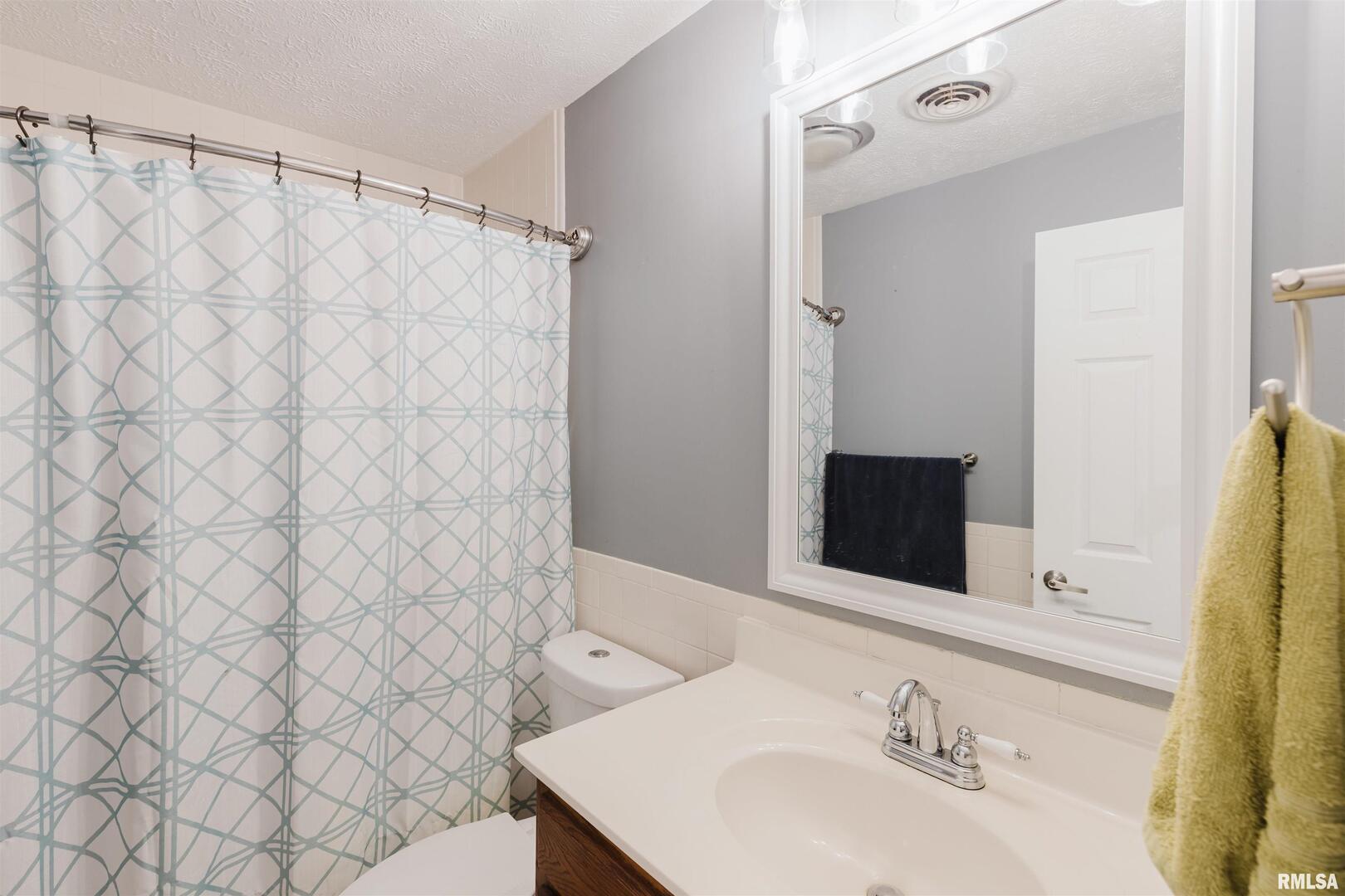 1821 South 27th Street Herrin, IL 62948 - Photo 18 of 35 a bathroom with a sink and a mirror