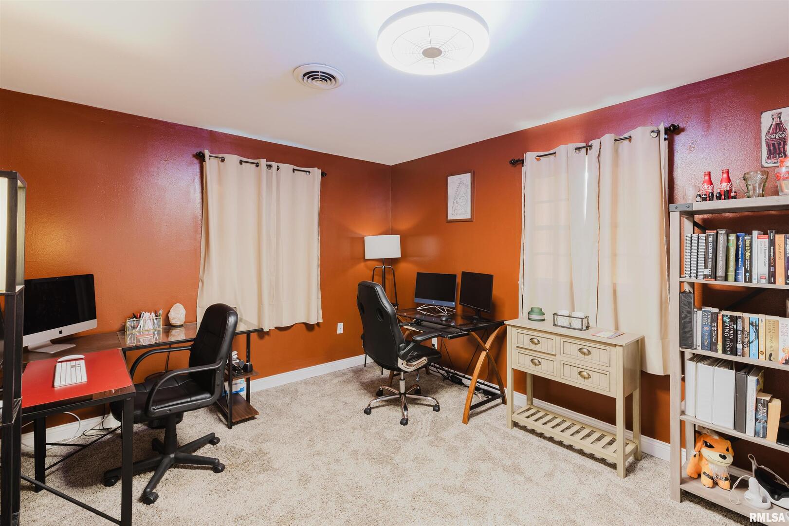 1821 South 27th Street Herrin, IL 62948 - Photo 19 of 35 a view of a workspace with furniture and a bookshelf