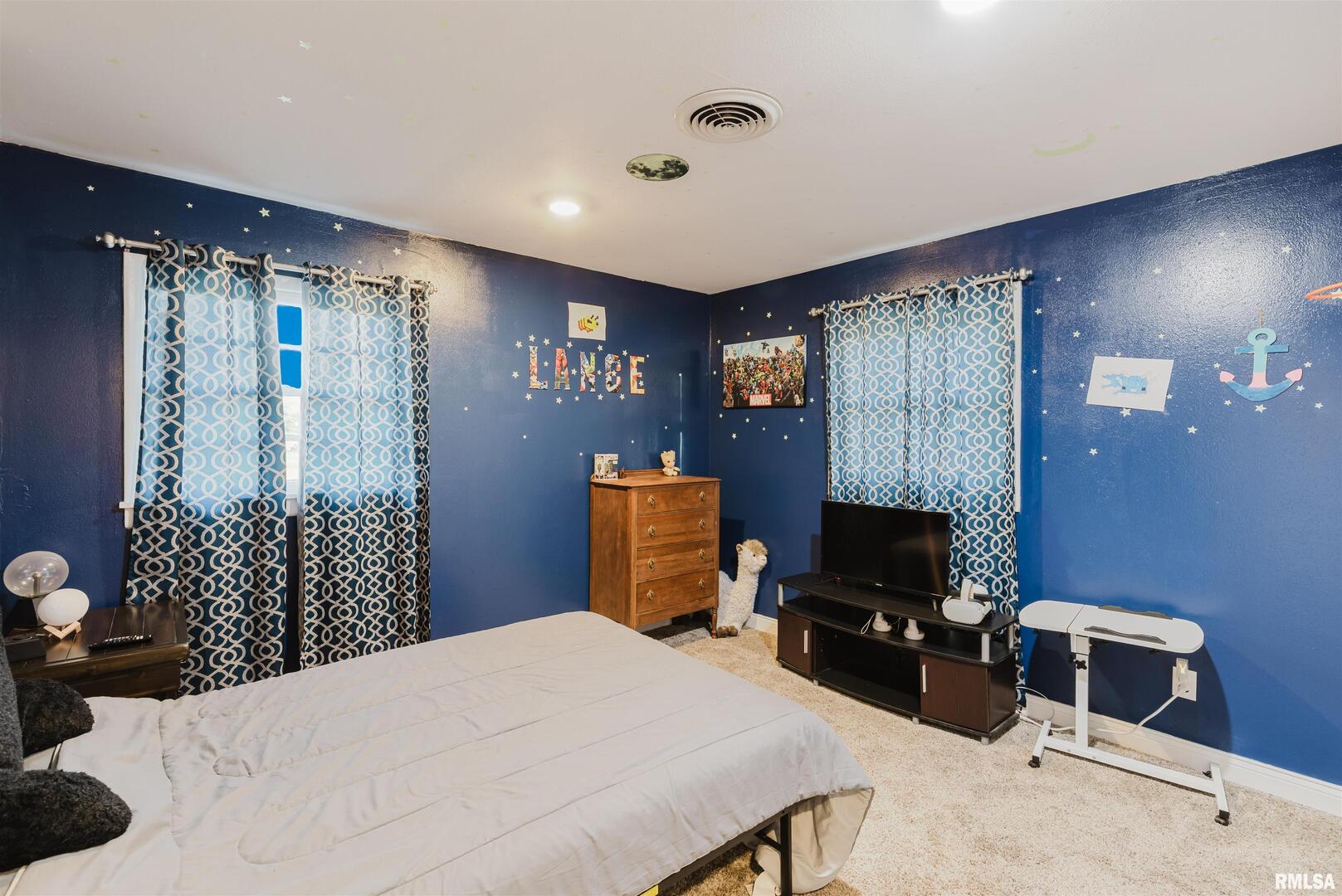 1821 South 27th Street Herrin, IL 62948 - Photo 21 of 35 a bedroom with a bed and a television