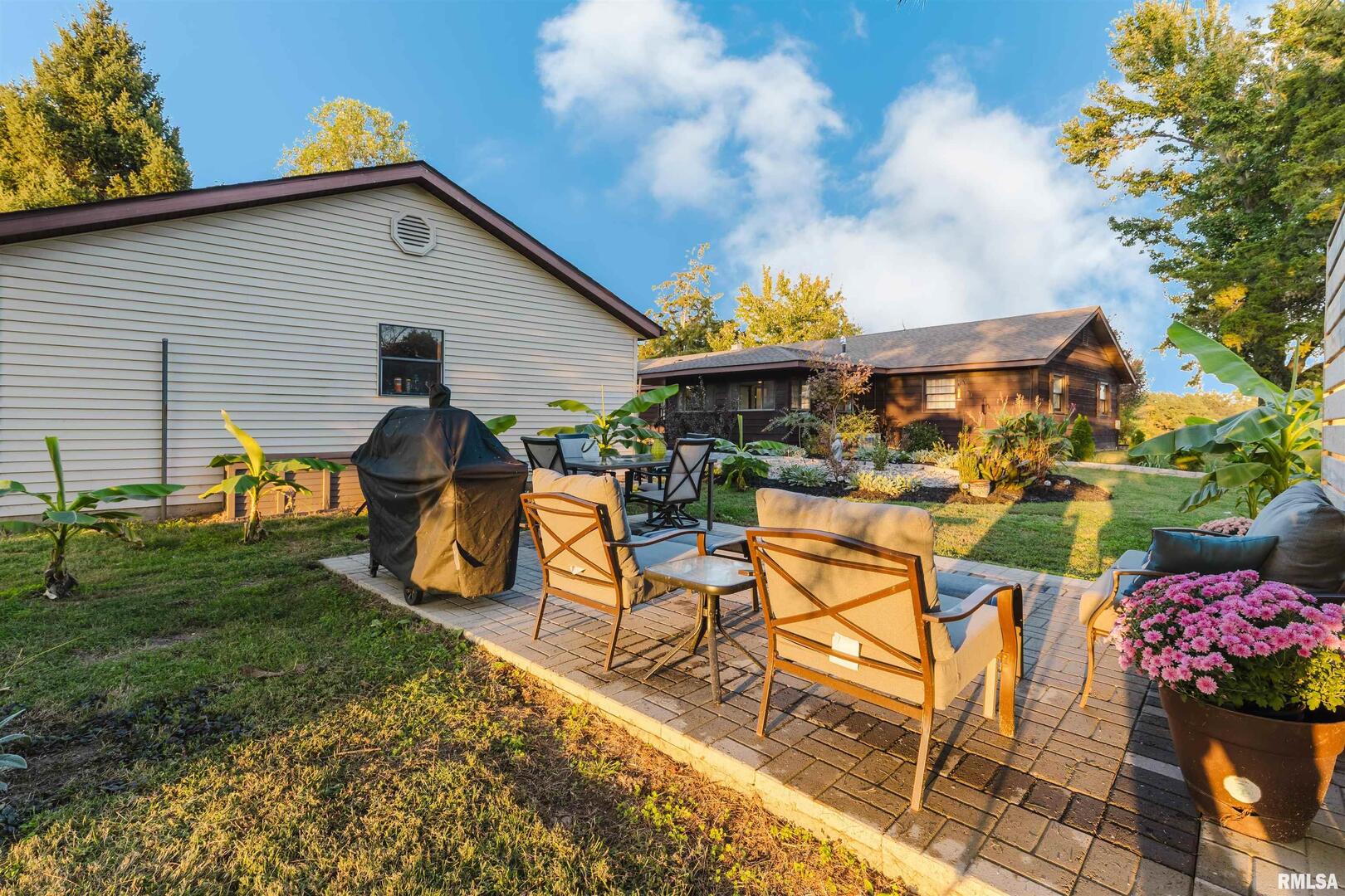 1821 South 27th Street Herrin, IL 62948 - Photo 28 of 35 a view of a chairs and table in backyard