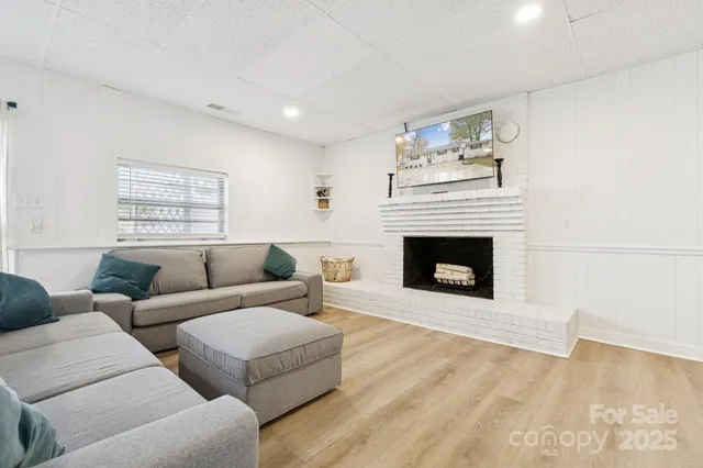 a living room with couches and a fireplace