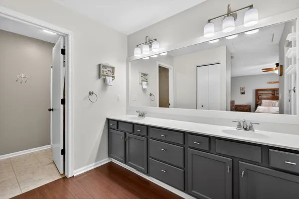 a spacious bathroom with a double vanity sink mirror and double