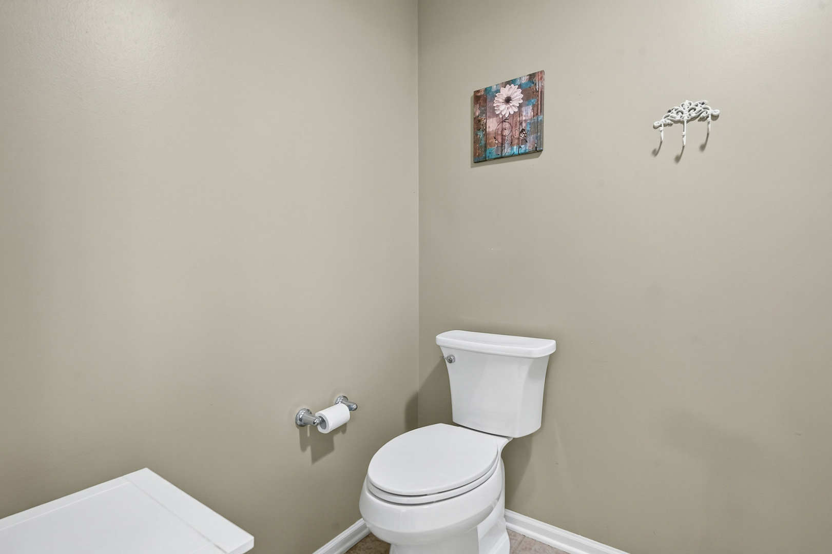 1152 Rose Drive Sycamore, IL 60178 - Photo 23 of 34 a white toilet sitting next to a white wall