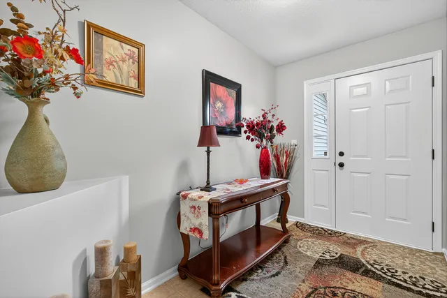 a bedroom with furniture and a window