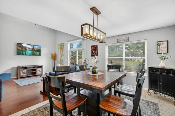 a view of a dining room with furniture window and outside view