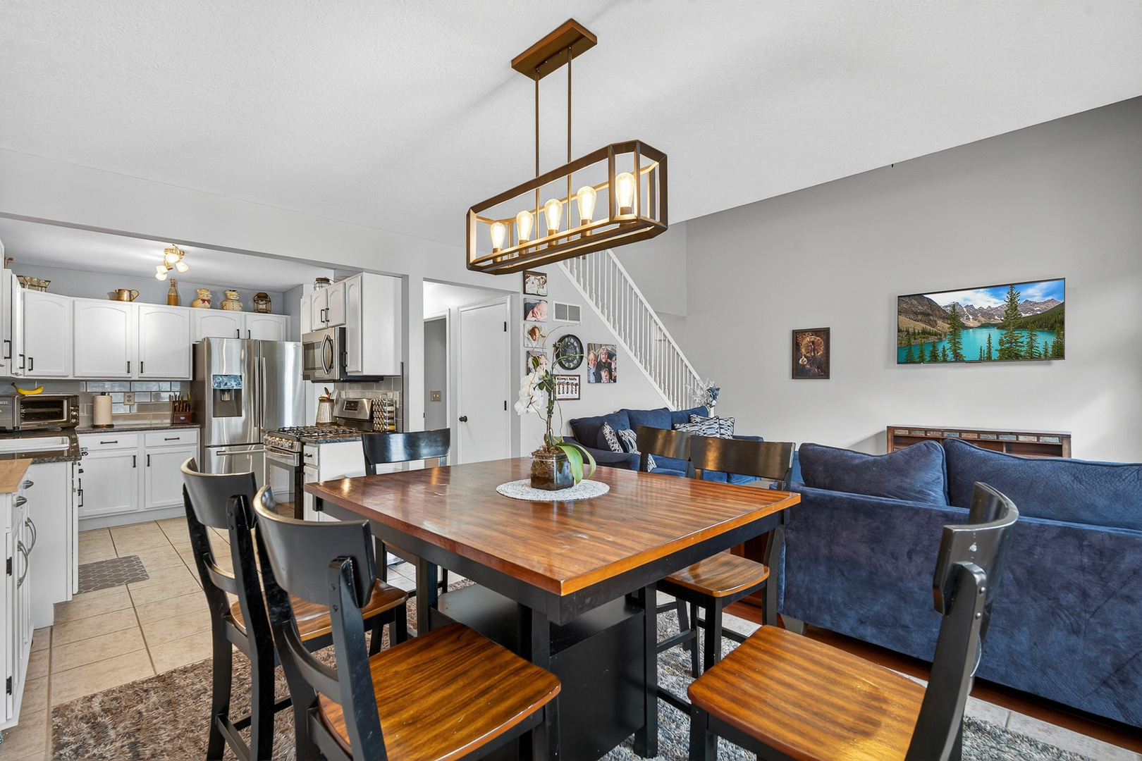 1152 Rose Drive Sycamore, IL 60178 - Photo 9 of 34 a view of a dining room with furniture and a chandelier