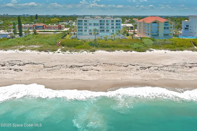 a view of a backyard with chairs