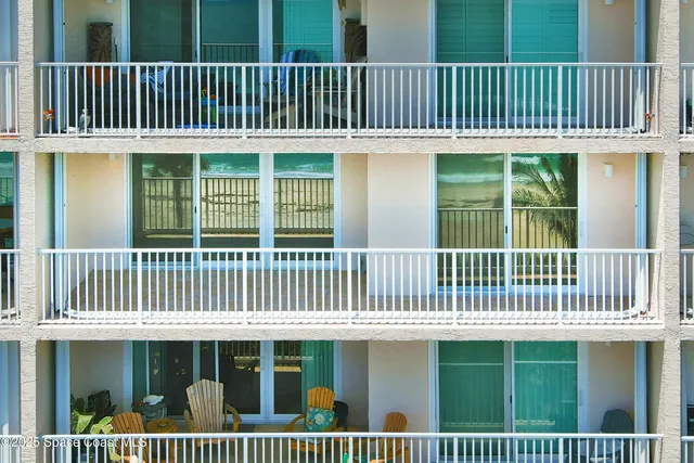 a view of a livingroom with wooden floor and furniture