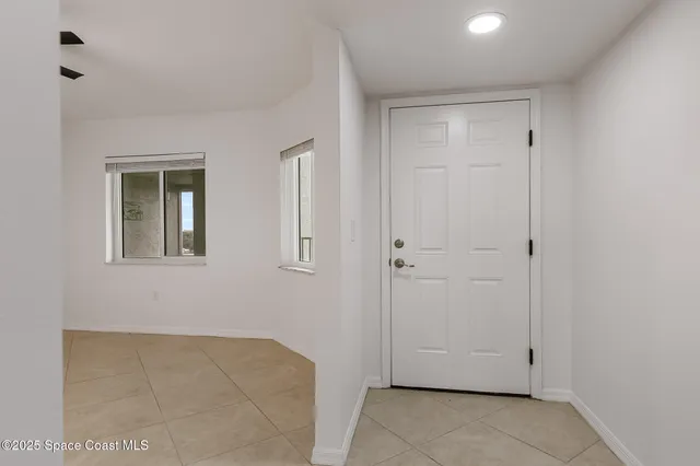 a bedroom with a bed couch and window