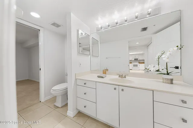 a view of a kitchen with a dishwasher cabinets and a wooden floor