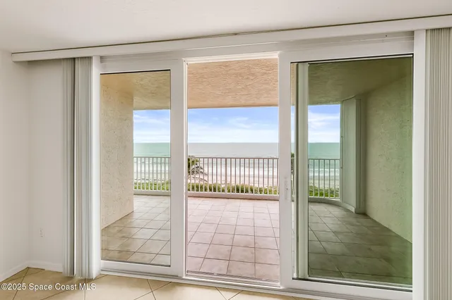 a view of a kitchen with white cabinets