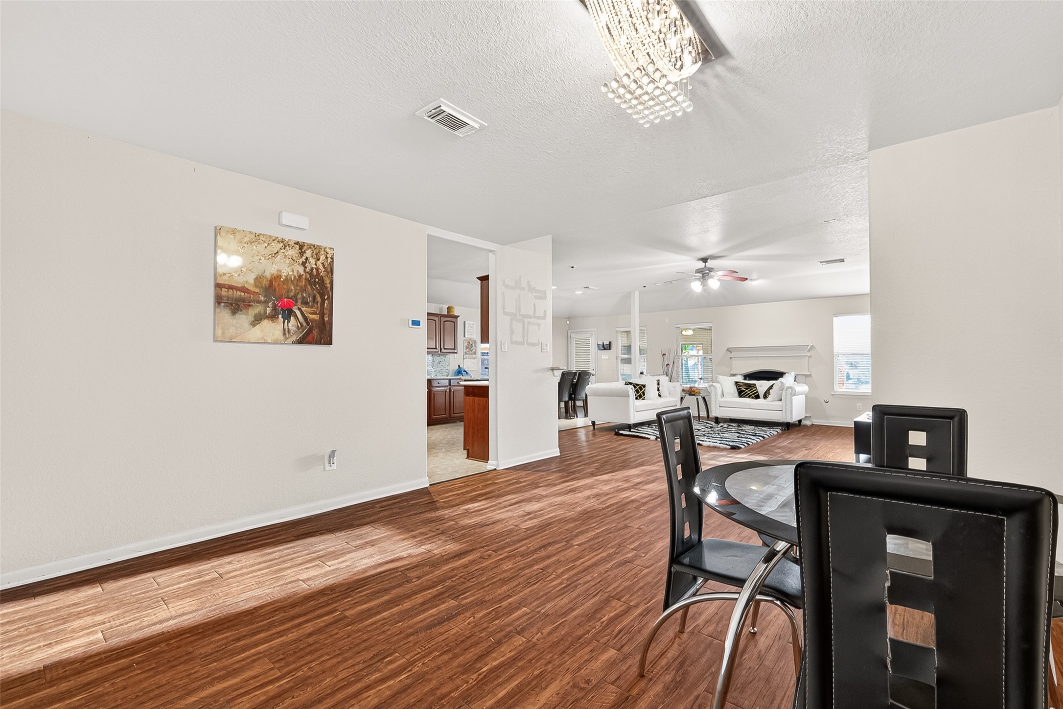 16715 Mackenzie Mesa Drive Spring, TX 77379 - Photo 7 of 50 a view of a dining room with furniture and wooden floor