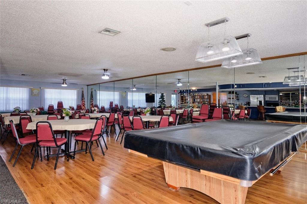 6777 Winkler Road, Unit 150 Fort Myers, FL 33919 - Photo 39 of 48 a view of a dining area with furniture and a large window