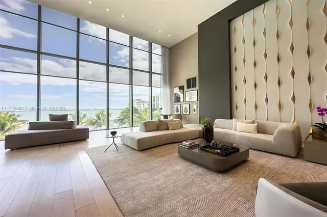 a living room with furniture and large flat screen tv