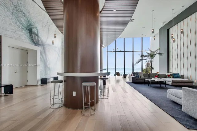 a view of a living room hardwood and kitchen