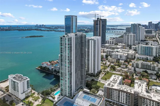 a swimming pool with outdoor seating and plants