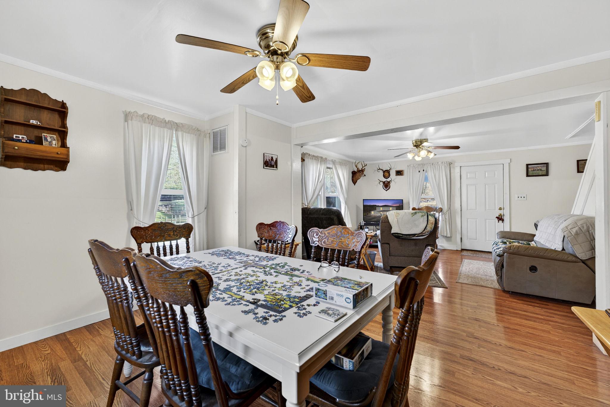 10500 Ford Hill Road Rio, WV 26755 - Photo 14 of 59 a view of a dining room with furniture and wooden floor