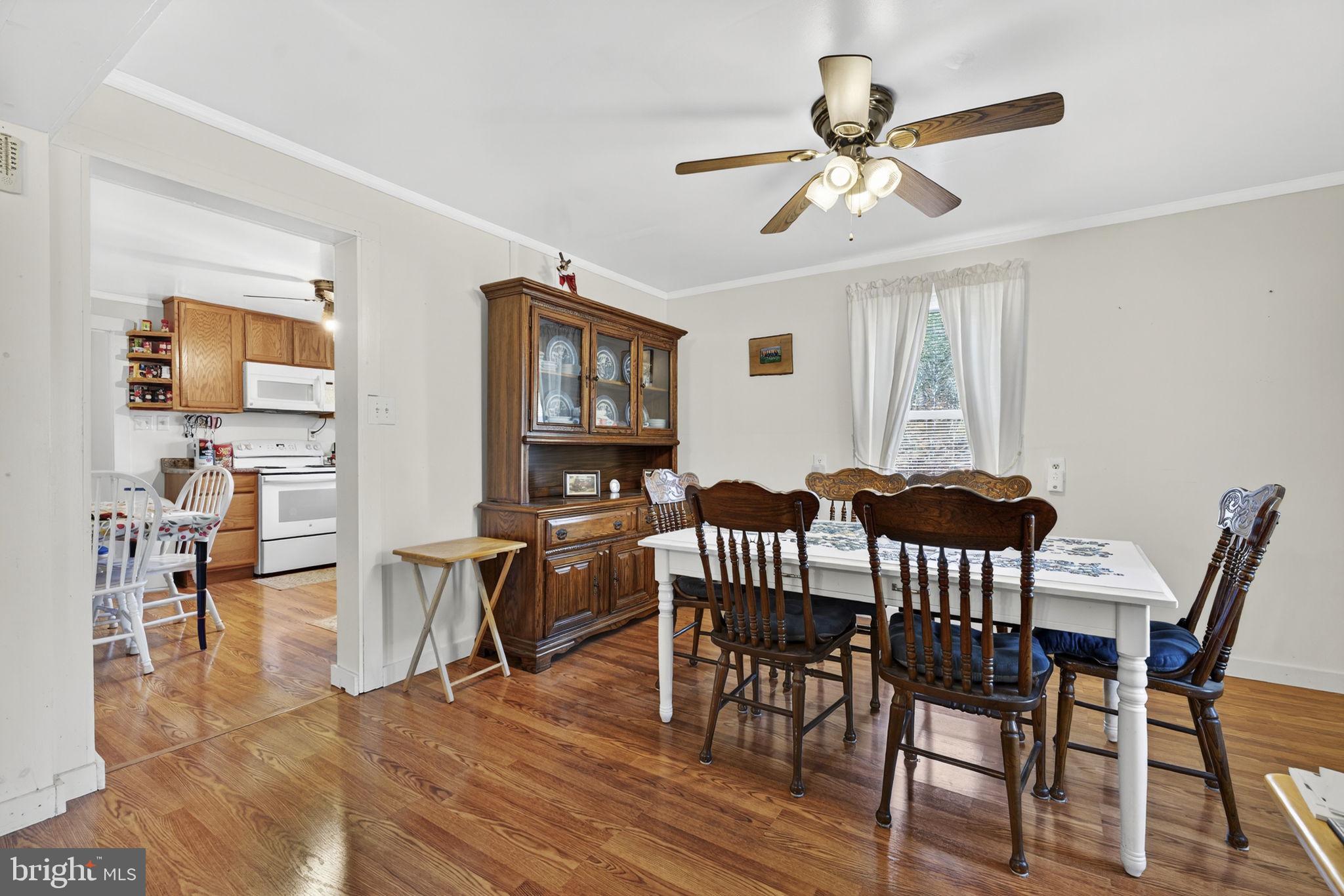 10500 Ford Hill Road Rio, WV 26755 - Photo 16 of 59 a view of a dining room with furniture and wooden floor