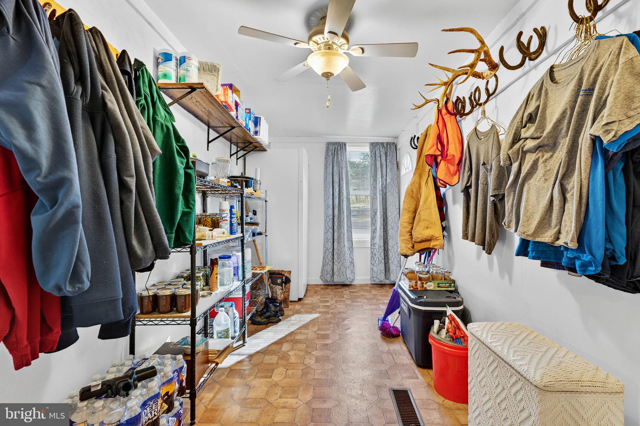 10500 Ford Hill Road Rio, WV 26755 - Photo 17 of 59 a view of walk in closet with clothes and shoes