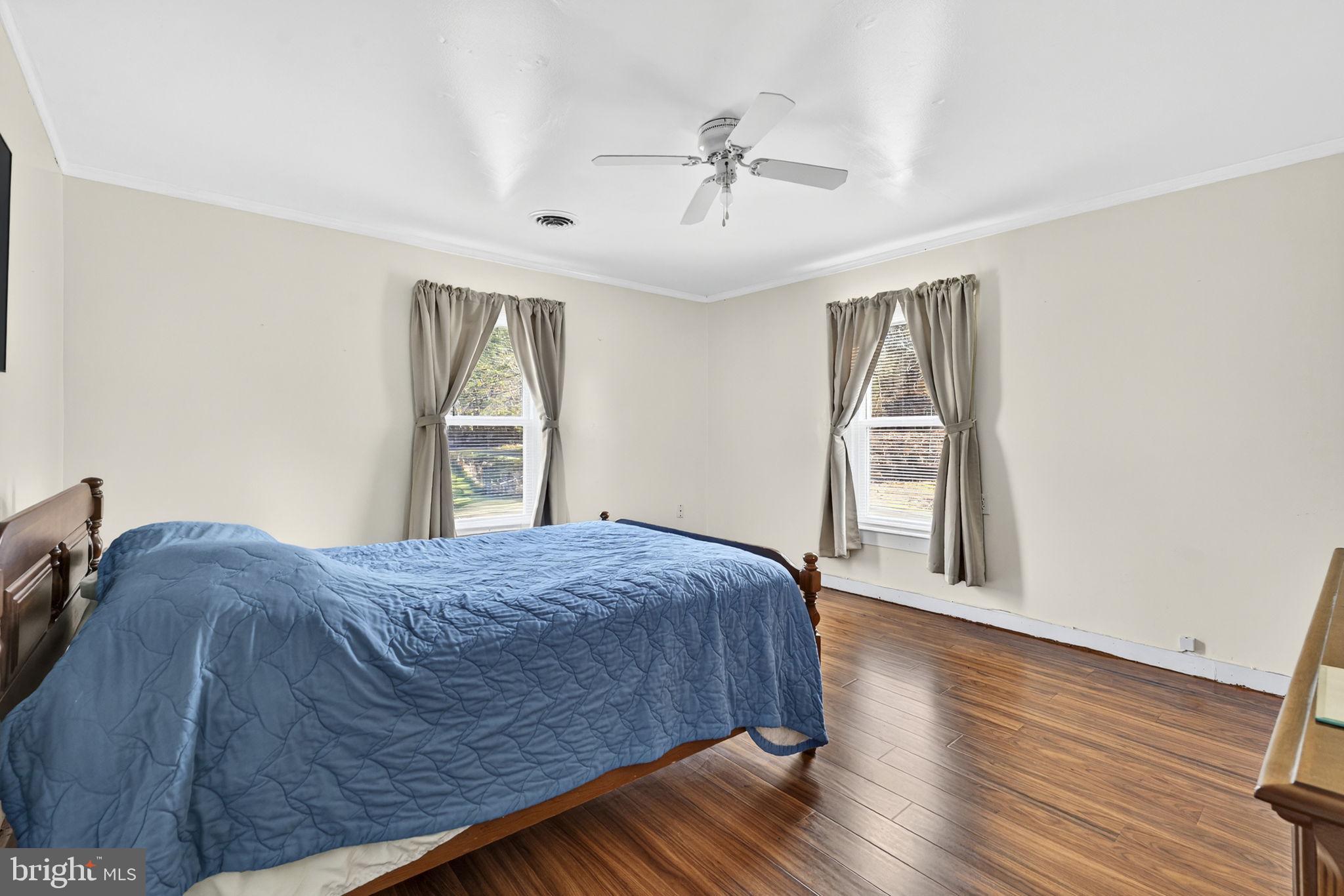 10500 Ford Hill Road Rio, WV 26755 - Photo 21 of 59 a bedroom with a bed and wooden floor