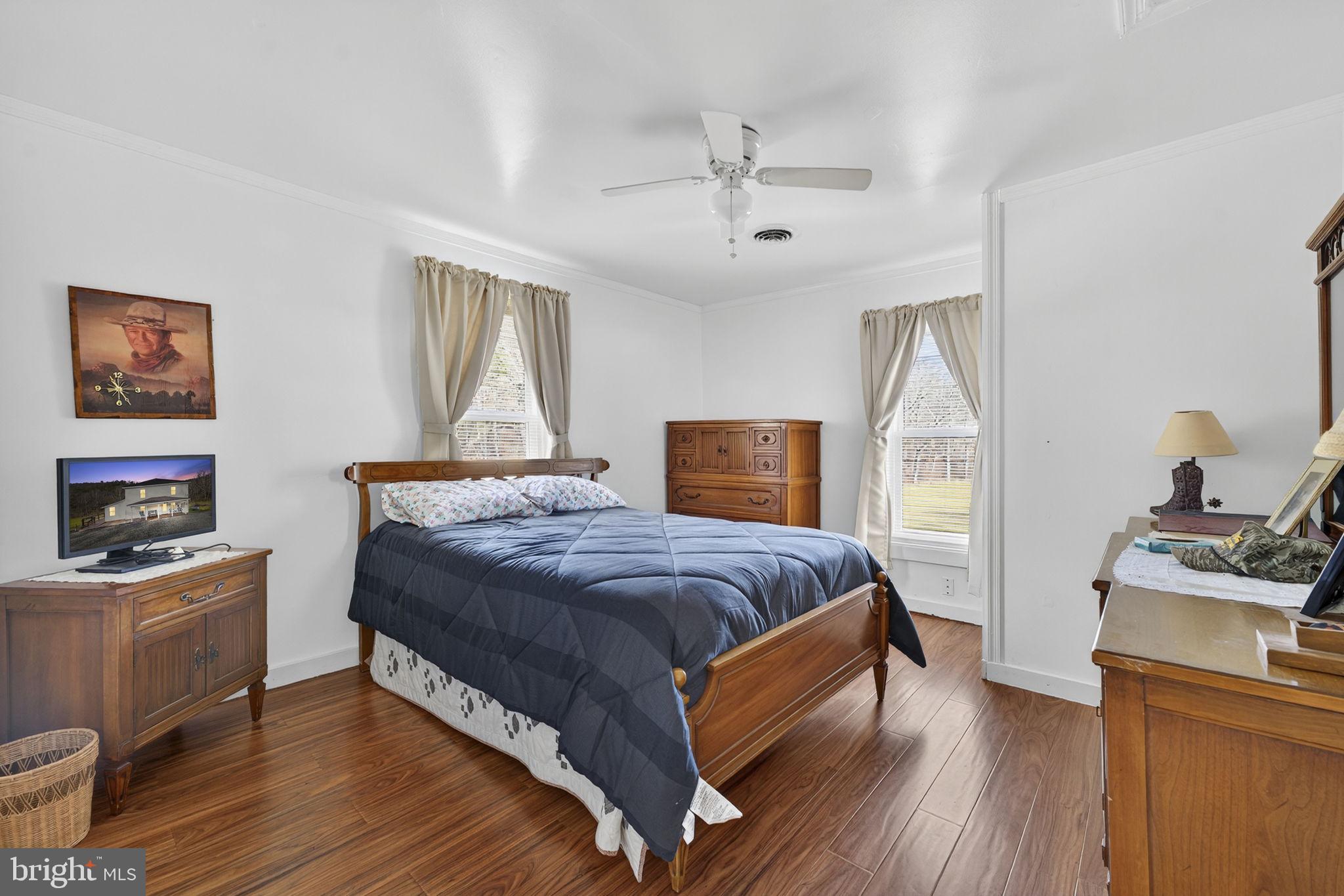 10500 Ford Hill Road Rio, WV 26755 - Photo 22 of 59 a bedroom with a bed and a flat screen tv
