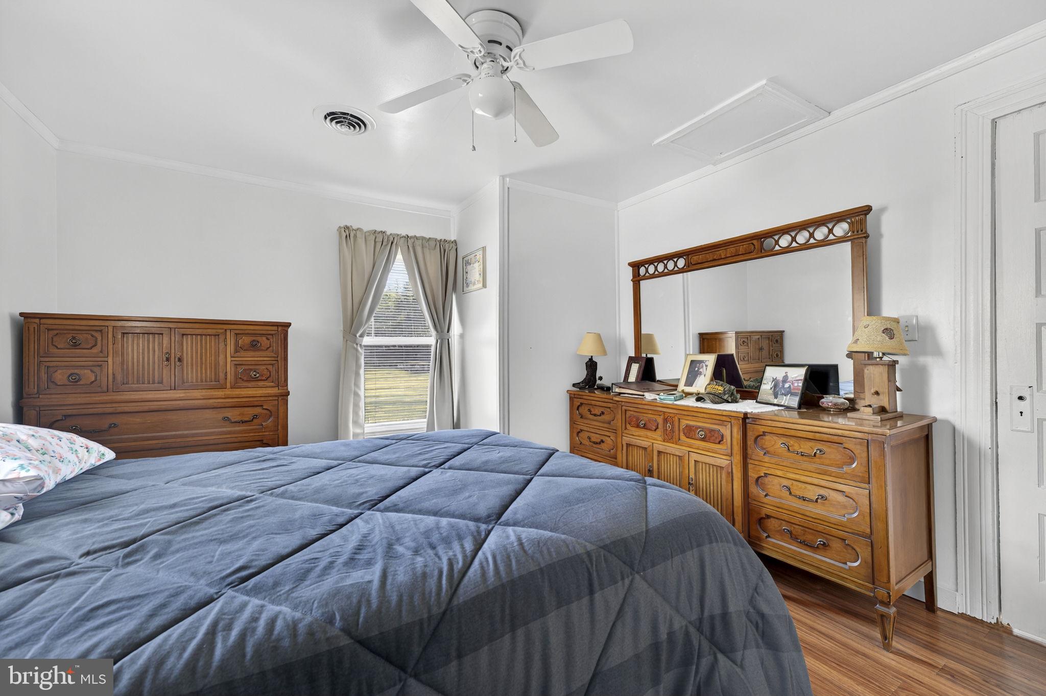 10500 Ford Hill Road Rio, WV 26755 - Photo 23 of 59 a bedroom with a bed and a dresser