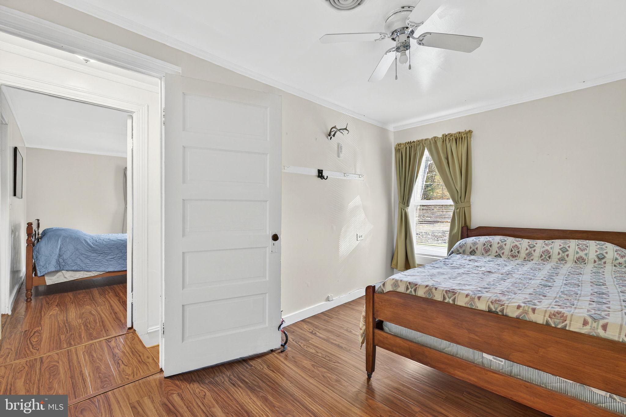 10500 Ford Hill Road Rio, WV 26755 - Photo 24 of 59 a bedroom with a bed and wooden floor