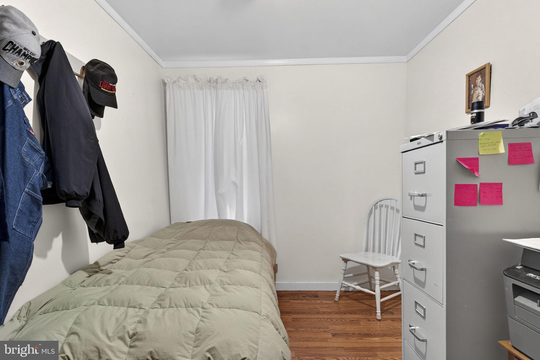 10500 Ford Hill Road Rio, WV 26755 - Photo 26 of 59 a bedroom with a bed and a chair