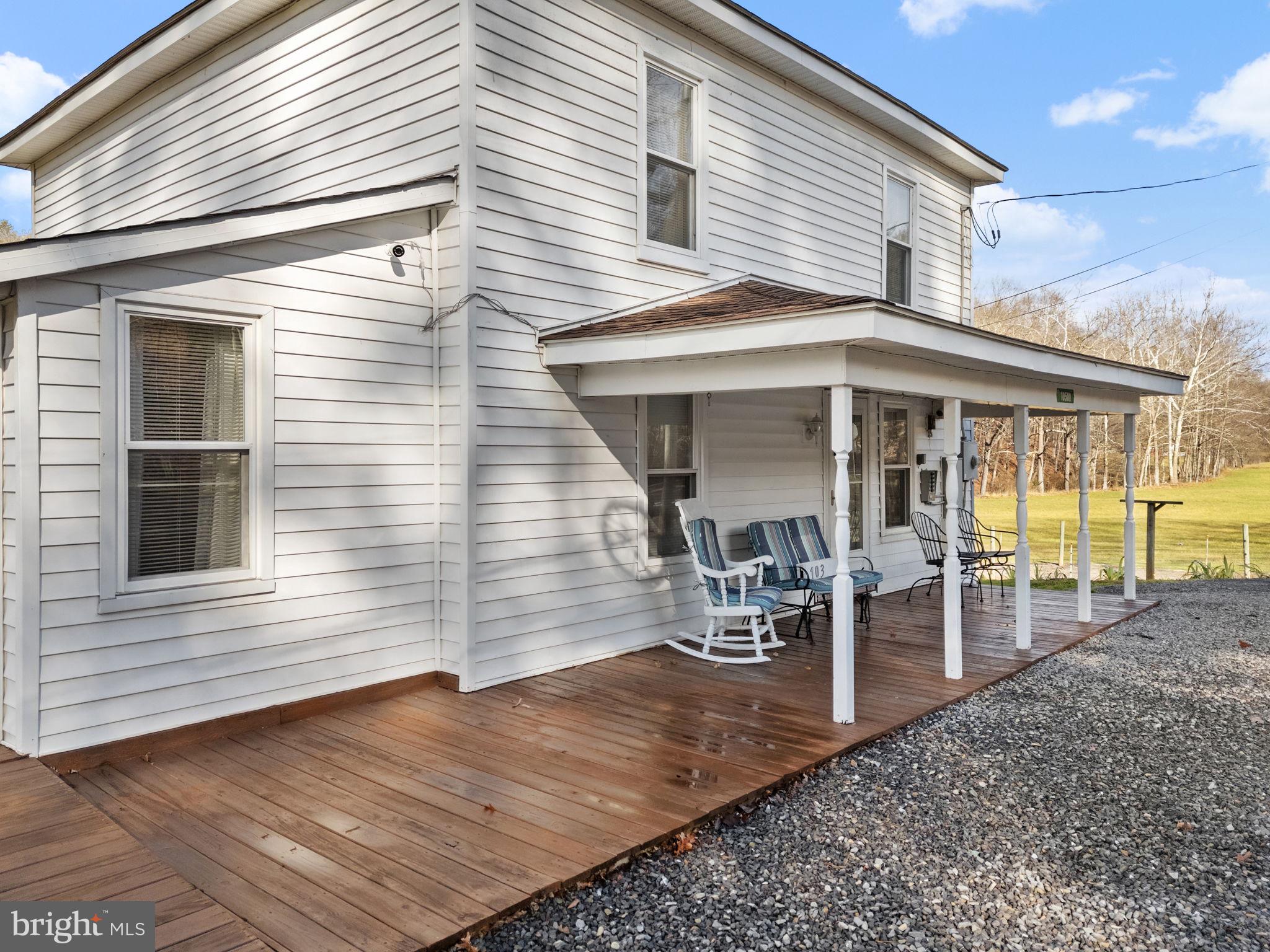 10500 Ford Hill Road Rio, WV 26755 - Photo 3 of 59 a view of a patio with table and chairs near a barbeque