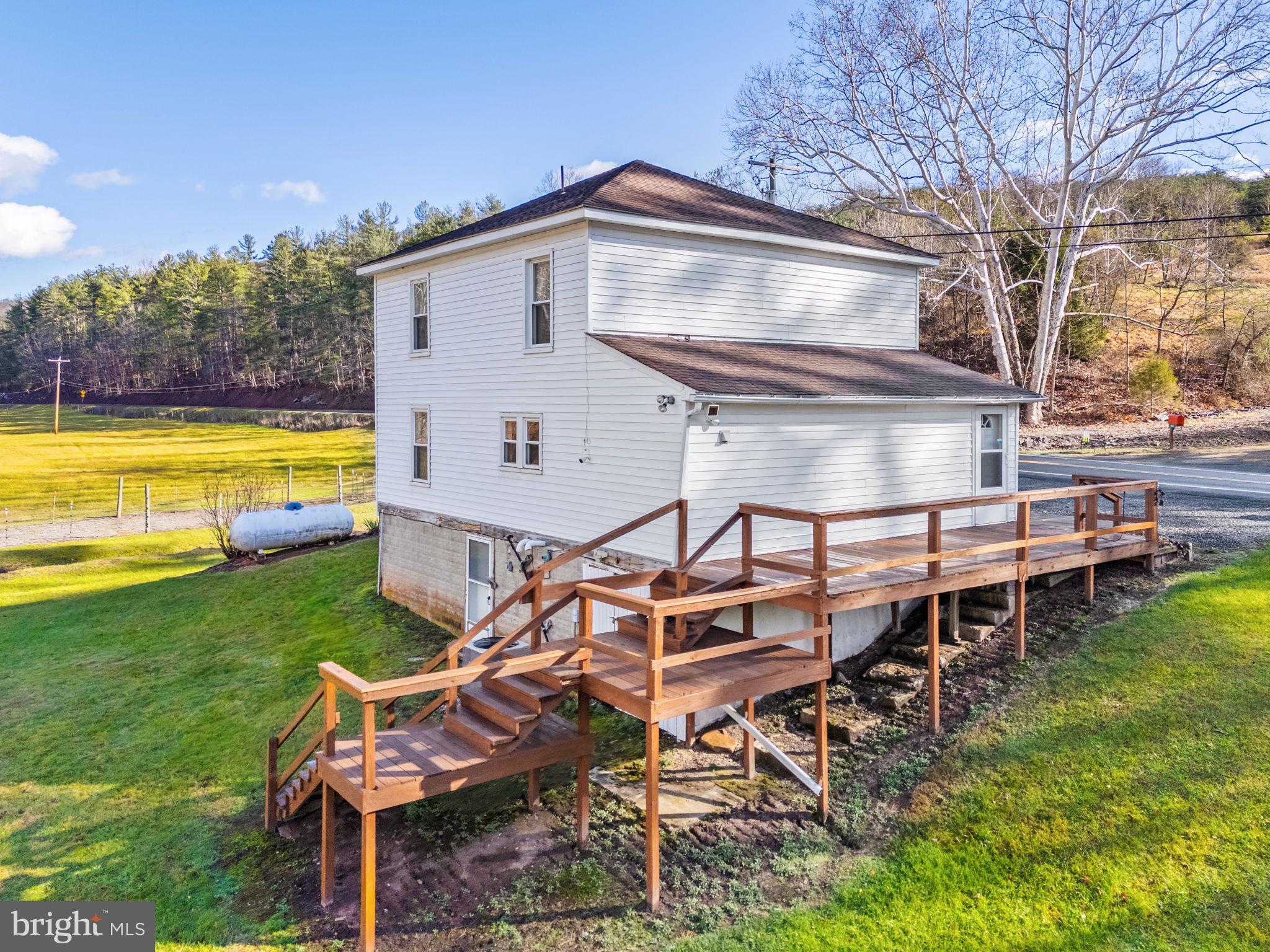 10500 Ford Hill Road Rio, WV 26755 - Photo 31 of 59 a view of a house with backyard porch and sitting area