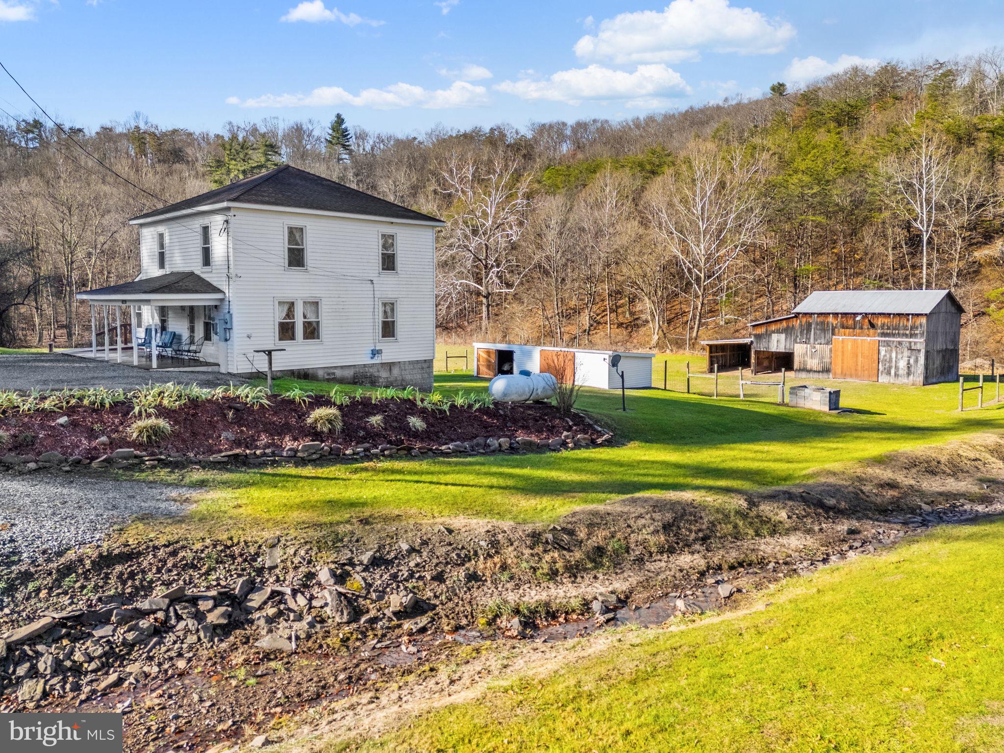 10500 Ford Hill Road Rio, WV 26755 - Photo 32 of 59 a front view of a house with swimming pool having outdoor seating