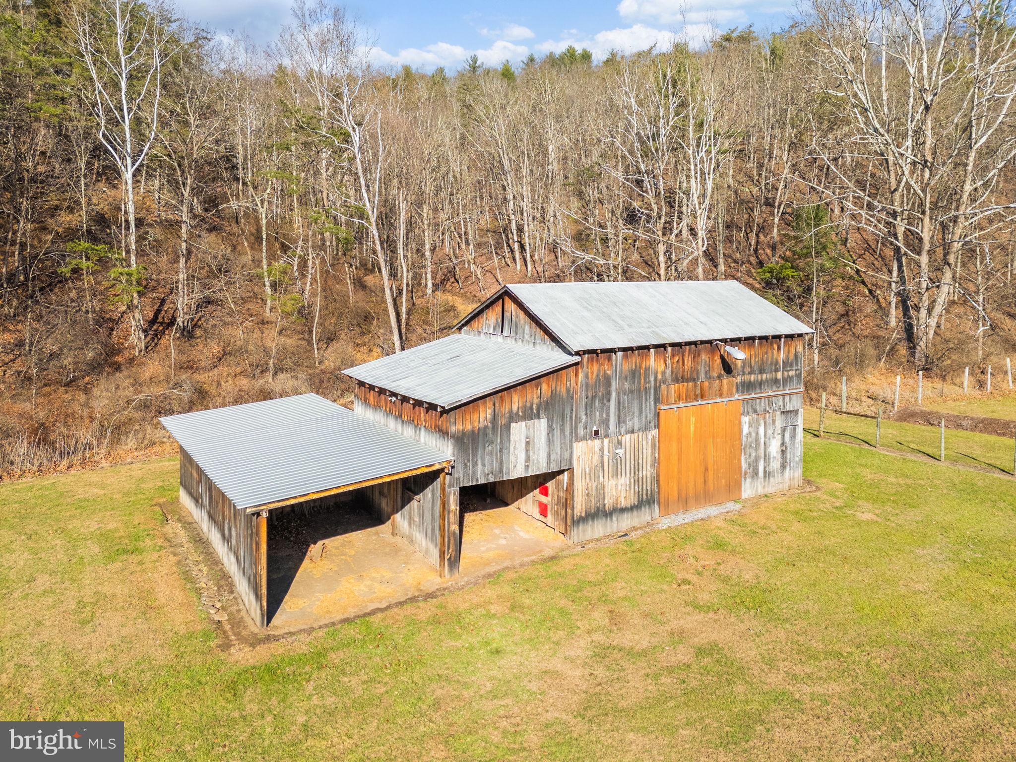 10500 Ford Hill Road Rio, WV 26755 - Photo 36 of 59 a view of a house with a yard and wooden fence